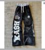 Pantalones de Pierna Ancha Falsos de Dos Piezas de la Nueva Serie Trendy 'Spray-Painted' para Adolescentes y Parejas Hip-Hop Pantalones de Doble Capa Venta al por Mayor
