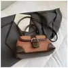 Bolsa de mão de nicho de alta qualidade transfronteiriça para mulheres, nova bolsa tote retrô de moda para o dia a dia, bolsa de ombro e transversal versátil