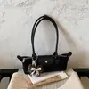 Bolso tipo baguette de lujo de nicho estilo francés, bolso tipo dumpling moderno y a la moda, adecuado para el uso diario, bolso versátil y moderno para hombro y debajo del brazo