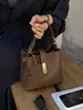 Bolsa de balde de nicho de alta qualidade transfronteiriça feminina nova elegante com temperamento bolsa de mão para o trabalho bolsa de ombro única transversal moderna