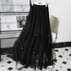 Novo saia de malha com laço afuniladora de cintura alta, outono de 2026, saia curta de design nicho de comprimento médio