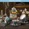 Set de Té de la Tarde Británico Estilo Europeo Lujo Ligero Porcelana de Hueso Taza de Té con Flores Olla de Vidrio para Frutas con Filtro Calentamiento con Vela