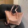 Bolso grande de lona de color liso a la moda para mujer, nuevo bolso de hombro de gran capacidad 2025, bolso de clase para estudiantes universitarios.