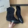Botas curtas de camurça bico fino estilo europeu e americano para mulheres, atacado transfronteiriço, novas botas de cano alto da moda versáteis para calçar sem cadarços, outono e inverno de 2026