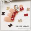 Joyería de uñas con lazo rojo mini roja en línea japonesa al por mayor diy punta del dedo aleación pequeños accesorios decoración de uñas