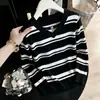 Top de punto de manga larga a rayas con cuello halter en V para Otoño/Invierno 2026 Suéter que disimula la barriga