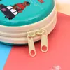 Bolsa para monedas de hojalata Caja de almacenamiento redonda para auriculares Bolsa para monedas Paquete de regalo navideño Fabricante Mayorista