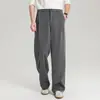 Pantalones casuales grises de pierna ancha para hombre, nuevo estilo de verano 2026, pantalones de traje fluidos, pantalones rectos holgados y estilizados