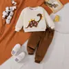 Conjunto de franela para niños de comercio exterior transfronterizo otoño e invierno, con un diseño de bordado de dinosaurio de dibujos animados, que consta de una sudadera de manga larga y pantalones largos, un conjunto de dos piezas para niños