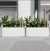 Caja de flores de acero inoxidable para exteriores combinación soporte de flores de hierro departamento de ventas valla de plantación verde partición canaleta para flores cama de flores exterior de restaurante
