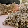 Conjunto de cuatro piezas con estampado de leopardo, lazo, lavado vintage, amigable con la piel, aprobado por influencers, serie linda y femenina, en stock para venta al por mayor