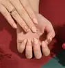 Uñas Portátiles de Navidad Copo de Nieve Amor Brillo Manicura Uñas Postizas Cortas Almendra Mariposa Uñas Largas Europeas y Americanas Venta al por Mayor
