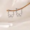 Aretes de circonita de mariposa estilo francés para mujer, aretes cortos retro huecos, aretes personalizados para street style, estilo frío, temperamento de lujo ligero