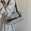 Bolsa tote versátil de bolinhas de nicho estilo coreano para mulheres, novo modelo 2026, bolsa de ombro para o dia a dia, bolsa de mão casual da moda