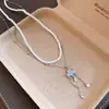 Collar de Cadena para Clavícula con Borla de Zirconia Nube y Perlas, Dulce y Delicado, Versátil, Sensación de Lujo Ligero y Gama Alta