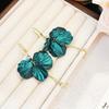 Colgante de gancho para oreja con borla de pétalo de circón verde estilo Hong Kong retro lujo ligero diseño de alta gama moda temperamento pendiente para socialité