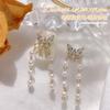 Año Nuevo uñas diamantes accesorios mayoreo lujo ligero celebridad de internet cadena lazo perla circonita colgante mariposa decoraciones de uñas
