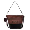Bolsa de mano vintage de alta calidad para mujer, gran capacidad, nueva colección otoño 2026, bolso de hombro versátil para ir al trabajo, estilo bolsa cubo