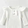 Nuevo producto de primavera y otoño para chicas europeas y americanas: top acanalado con manga de volantes y lazo y minifalda vaquera en un estilo fresco y sencillo, directo de fábrica
