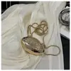 Mini Bolsa Concha de Metal Feminina Nova Bolsa Transversal Decorativa Design de Nicho Bolsa de Ombro com Corrente para Batom Venda por Atacado