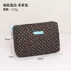 Bolsa de Monedas de Lunares de Venta Caliente Transfronteriza Portátil para Llevar Toallas Sanitarias Cables de Teléfono Lápiz Labial Bolsa de Maquillaje