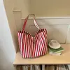 Bolso de lona a rayas de moda para mujer 2026 nuevo modelo bolso tote de gran capacidad bolso de hombro casual de gran capacidad para el trabajo