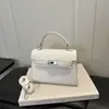 Outono 2026 Novo Estiloso Design de Nicho Alta Textura Alta Aparência Simples Versátil Ombro Cruzado de Mão Bolsa Kelly