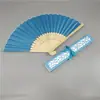 Comercio electrónico transfronterizo abanico femenino elegante más vendido 21cm abanico de boda abanico femenino caja hueca 14 colores opcionales