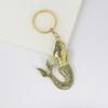 Fabricantes de joyas de comercio exterior europeos y americanos, venta al por mayor, llavero de sirena de metal vintage de acero inoxidable, adornos para llaves de bolso de mujer