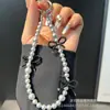Cadena para Teléfono Móvil Ins Casual Perla Dahua Cadena de Color Contrastante con Lazo Funda para Teléfono Móvil Correa de Mano para Muñeca Llavero