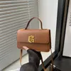La popular de este año 2024 nueva moda simple bolsa cuadrada pequeña bolso de mano para grupos pequeños bolso de hombro cruzado de alta gama bolso de mujer