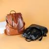Mochila de cuero suave para mujer, estilo coreano 2021, moderna, combinable, antirrobo, para viaje, escolar, pequeña.