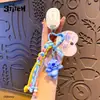 Baimao Llavero Colgante de Cuerda Trenzada de Cuero con Puntada Genuina Muñeca Exquisita de Dibujos Animados Colgante Lindo para Bolso de Pareja