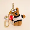 Colgante de Oso Frijol Lindo Bolso de Punto de Invierno Muñeco de Peluche de Dibujos Animados Colgante Regalo