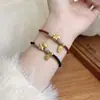 Pulsera de Cuerda con Dijes de Caballo Dorado al por Mayor para el Año del Caballo, Año del Zodiaco, Pulsera Trenzada Roja y Negra para Hombres y Mujeres