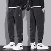 Calça de Veludo Cotelê com Forro de Fleece Masculina Outono e Inverno Perna Larga Esportiva Casual Calça de Moletom Moda Calça Térmica Interna