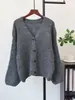 Nova Coleção Outono/Inverno 2026: Cardigan de tricô estiloso estilo coreano, com caimento solto, detalhes de laço e botões, suéter-casaco macio e confortável para mulheres