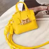Nuevo Colgante de Bolso Mini Versátil de Platino Llavero de Cuerda Trenzada Multifuncional Portátil para Bolsos Venta al por Mayor