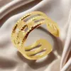 Anillo de acero de titanio chapado en oro de moda europea y americana, diseño de nicho de alta gama para mujer, anillo ajustable de acero inoxidable hueco con apertura