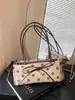 Bolso de axila de lunares estilo coreano, nicho súper popular para mujer, nuevo modelo otoño 2026, bolso de hombro exquisito y elegante, versátil para el trabajo