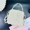 Bolsa de Miçangas Artesanal Estilo Retrô Francês 2026 Nova Versátil Branca Vazada Bolsa para Celular de Acrílico com Pérolas Artificiais
