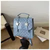 Mochila de Moda Estilo Coreano con Lazo para Mujer Verano 2026 Simple Moda Casual Bolso de Hombro de Alto Valor