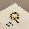 Anillo elástico popular de Xiaohongshu con cuentas de Piedra Ojo de Tigre Maillard, Anillo de Gato de moda, exquisito y lindo estilo Ins