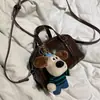 Bolsas Femininas 2026 Novo Estilo Coreano Bolsa de Mão de Luxo Pequena Nicho Bolsa de Ombro Transversal para Menina Bolsa Quadrada Pequena Versátil