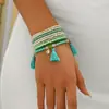Pulsera apilada de cuentas de semillas con colgante de borla de cuentas bohemia más vendida transfronteriza con un diseño geométrico de alta gama