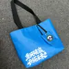 Sacola de papel DuPont com logo impresso personalizado, bolsa tote com zíper de ombro único e transversal, bolsa de mão para presente em estoque, bolsa à prova d'água para celular