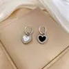 [Acero de titanio de cuerpo completo] Pendientes de viento minimalistas con diseño de concha, pendientes fríos para hombres y mujeres, pendientes de banquete con temperamento y personalidad