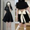 Vestido negro de verano 2024 para mujer, nuevo y atractivo vestido negro pequeño con cuello polo y lazo para chica, vestido camisero adelgazante con cintura.