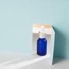 Botella de aceite esencial azul esmerilado de 15 ml, botella de vidrio subenvasada para cosméticos, botella con gotero y cabezal de pegamento para esencia
