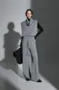 Chaleco de punto suelto adelgazante con cuello alto apilado estilo francés y pantalones rectos de pierna ancha para otoño-invierno, modelo nuevo de nicho 2026